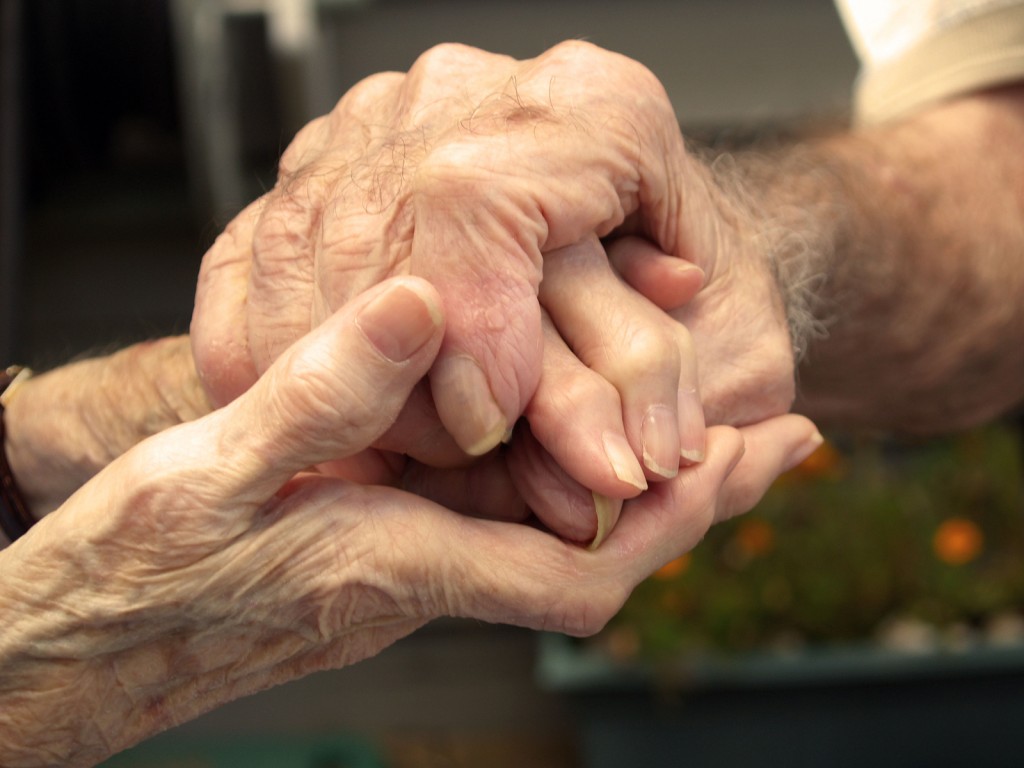 Old Couple Holding Hands