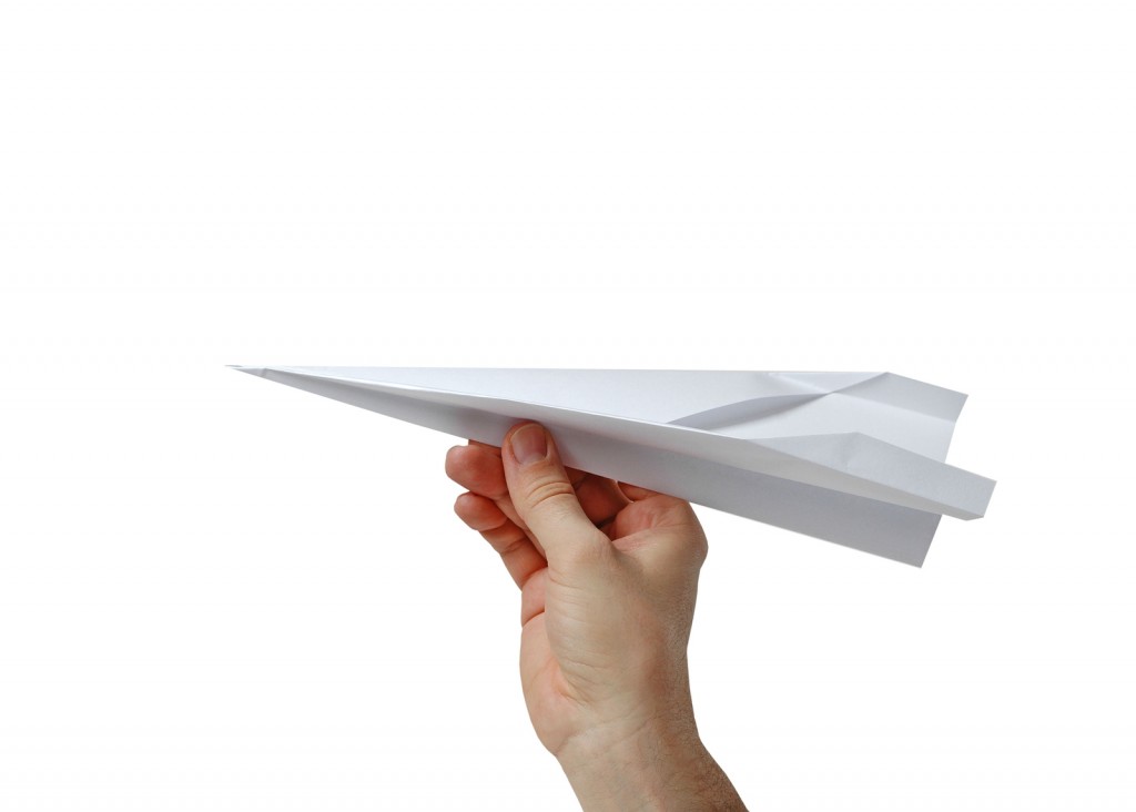 Hand Holding A Paper Plane